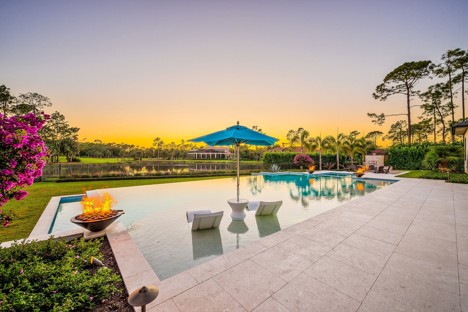 Remodel 3, pool terrace and fire bowls at sunset over the golf course
