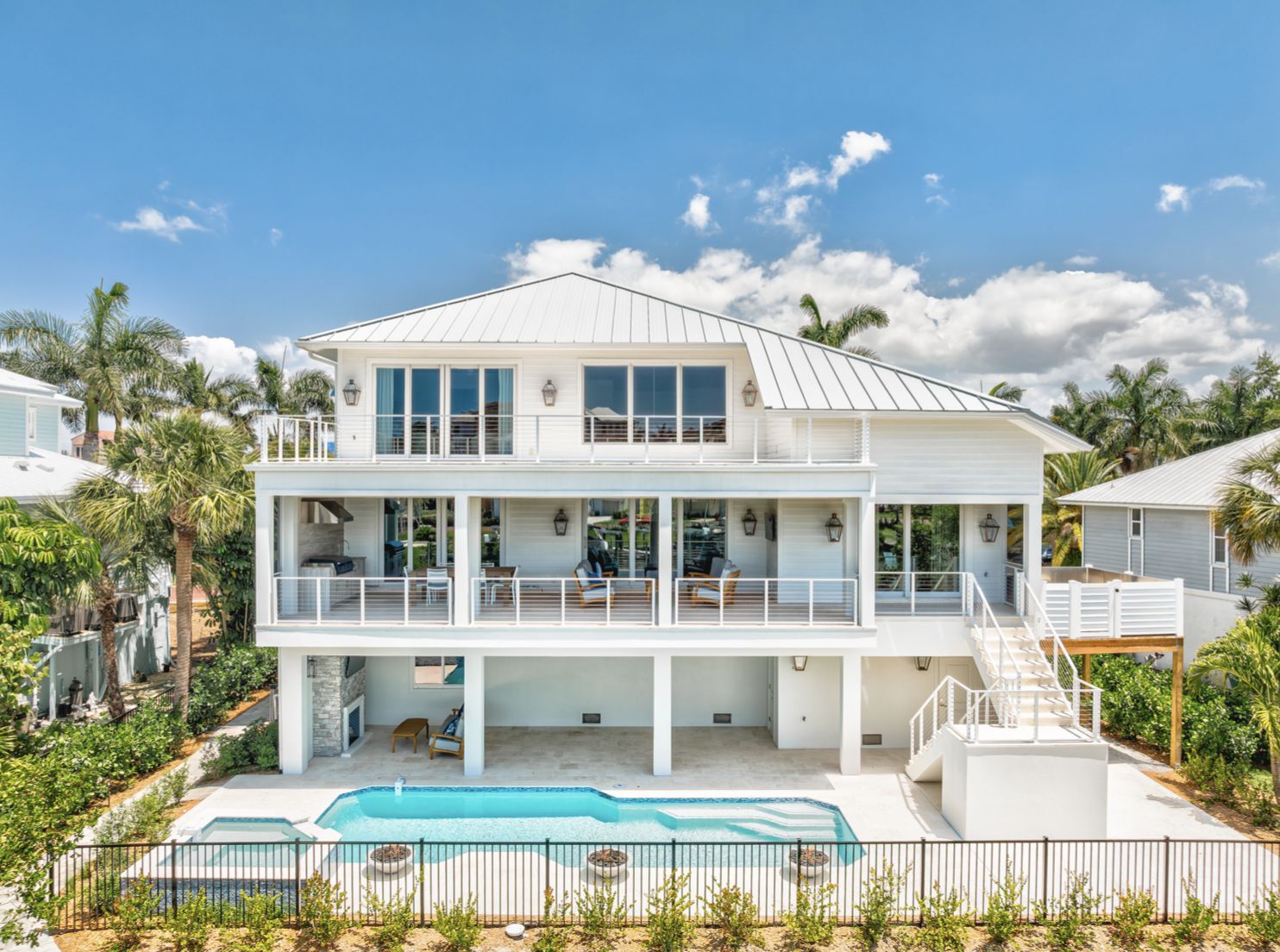 Southport, raised white coastal house with pool